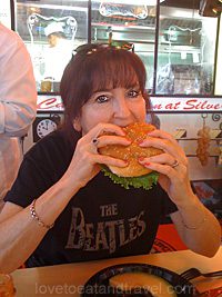 Alana eating a hamburger at Joe's Cable Car Restaurant - best burger in San Francisco, CA!