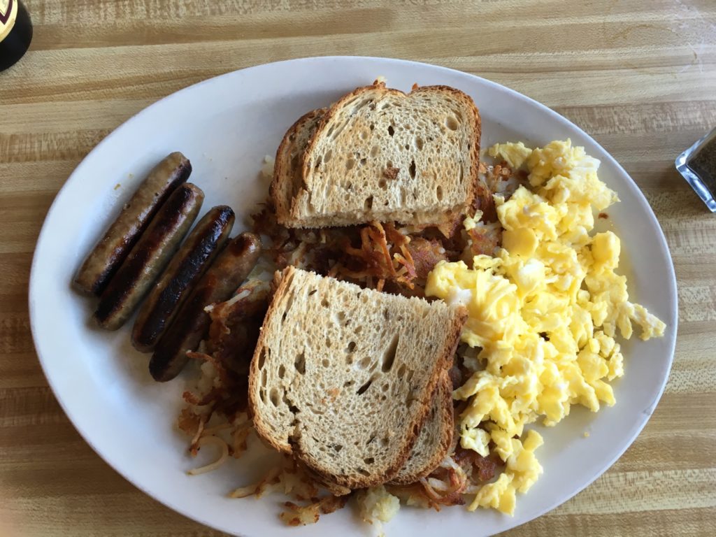Scrambled Eggs, Chicken Apple Sausage with crispy Hash Browns and rye toast at Hwy 92 Cafe – © LoveToEatAndTravel.com