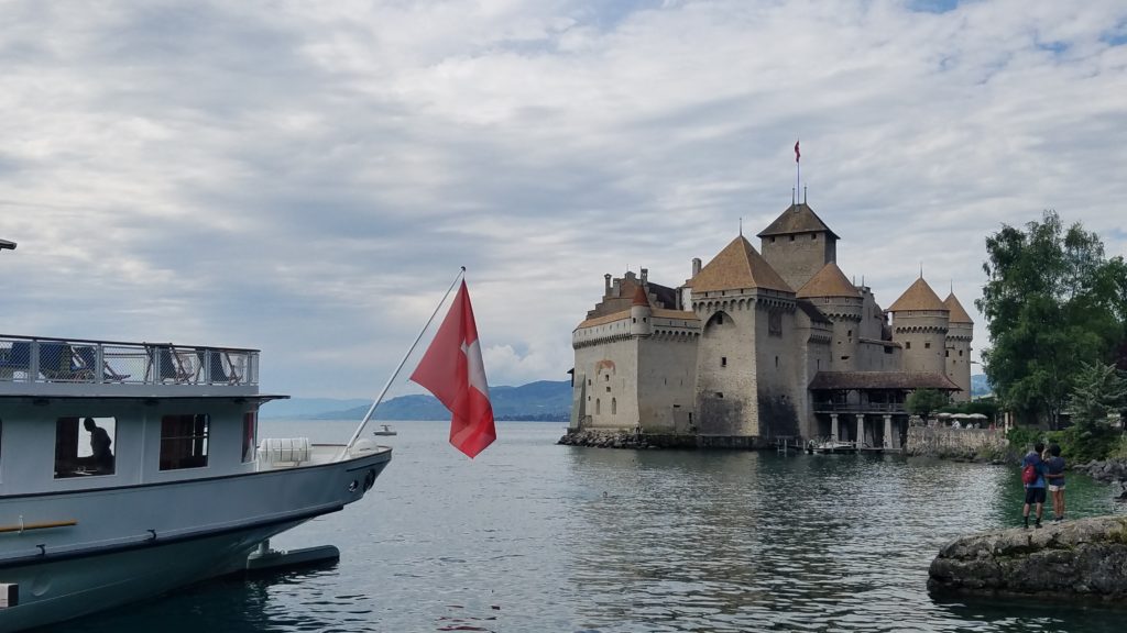 Montreux Chateau Chillon with boat and flag at left - Credit: Deborah Grossman