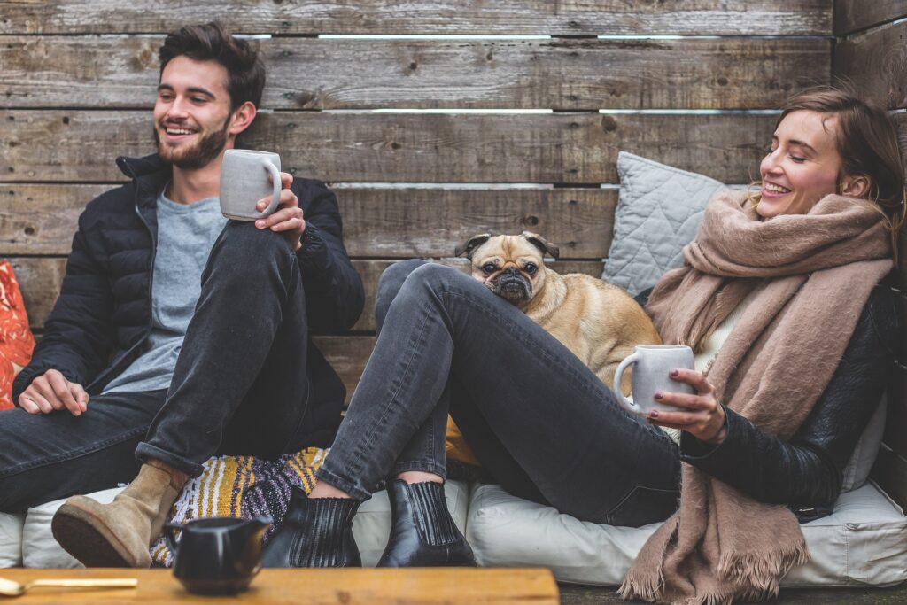 Work-Life Balance - couple with their dog having coffee