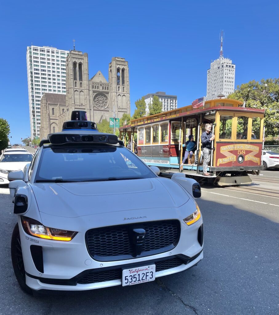 Waymo Self-Driving Car and Cable Car atop Nob Hill, SF - © lovetoeatandtravel.com